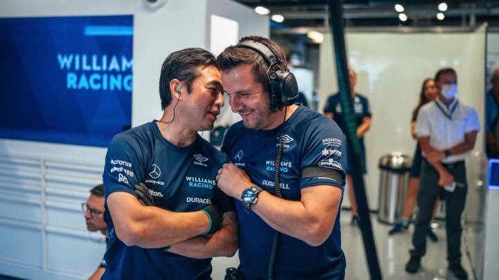 Chief Mechanic Ben Howard and Senior Spares Coordinator Kats Shirahata share a moment in the Williams Racing garage