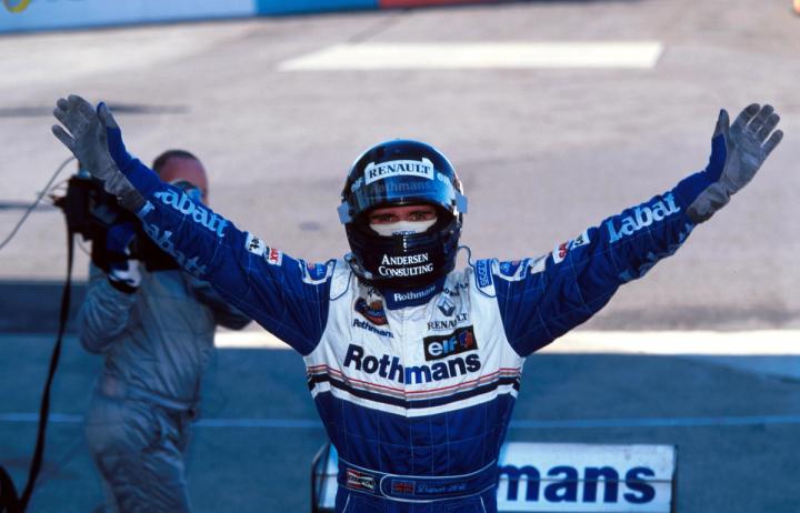 Damon Hill celebrates after winning the 1996 French Grand Prix