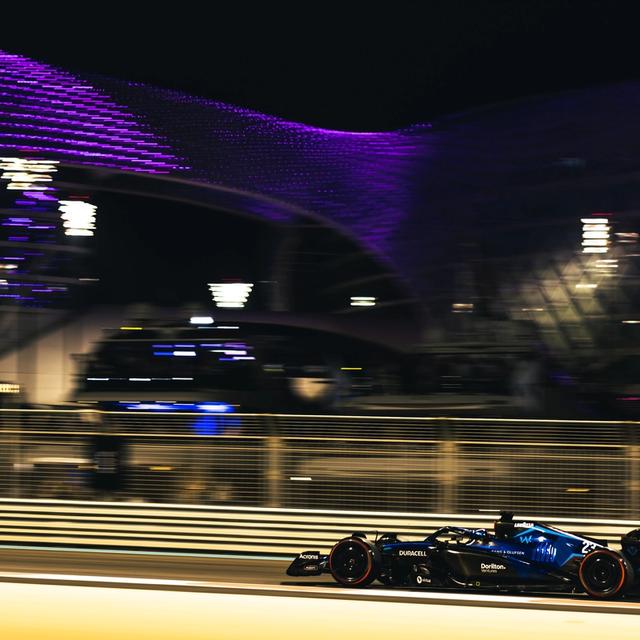 The W Hotel illuminates the sky as the FW44s put in their Q1 laps.