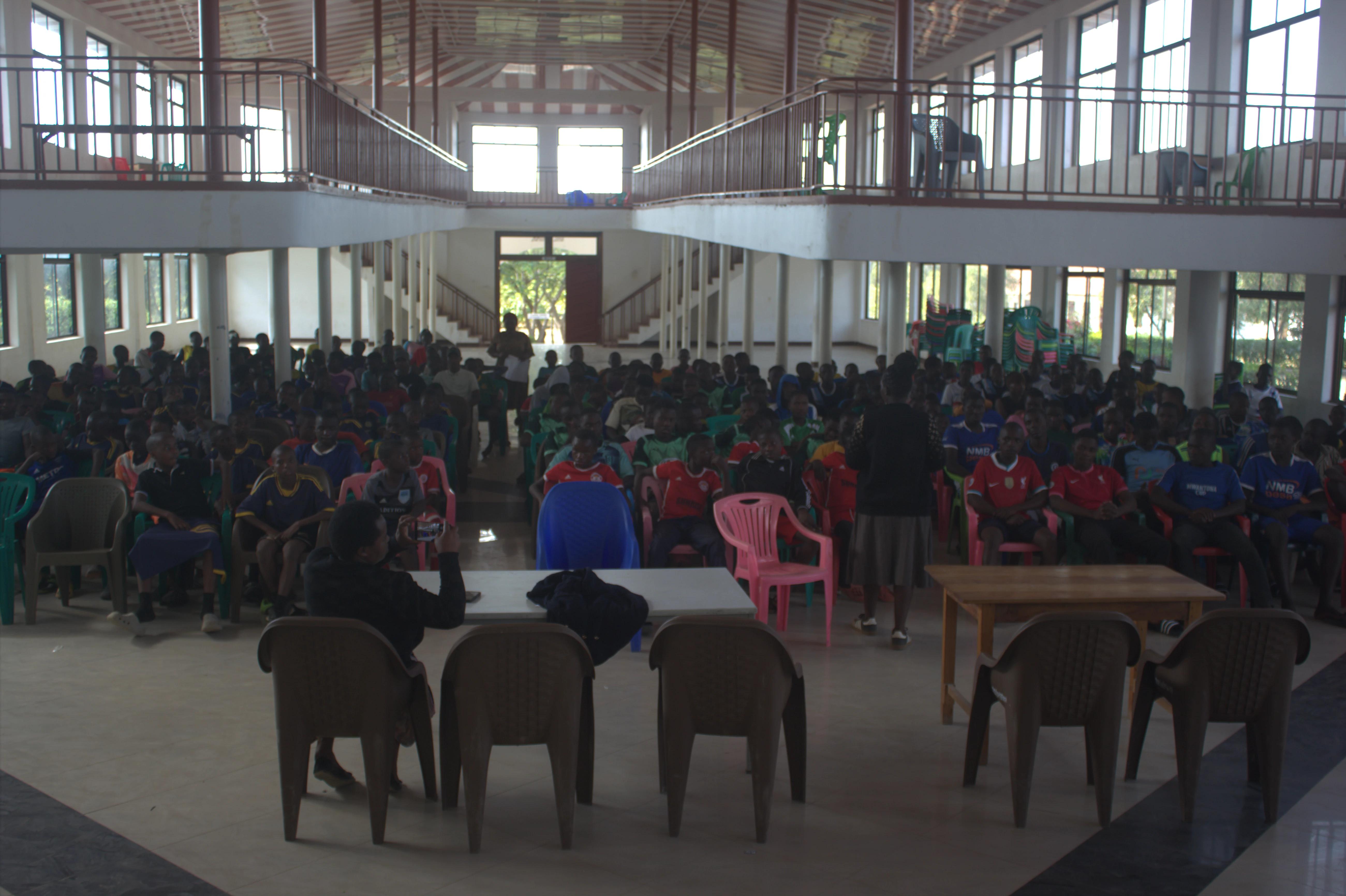 Teams and staff seated indoors for a SMAGAYOCO pre-tournament briefing