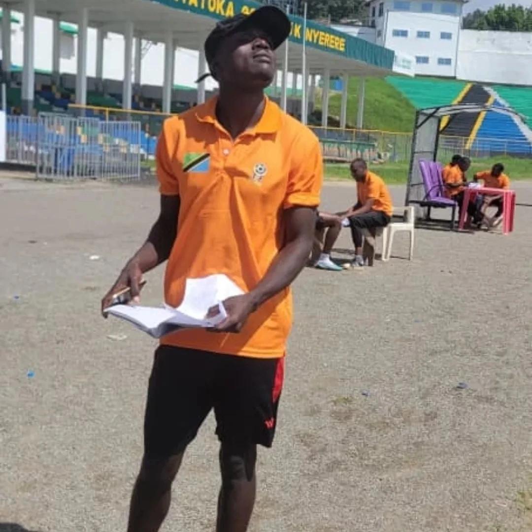 Football coach participating in a coaching activity at a Sokoine Stadium