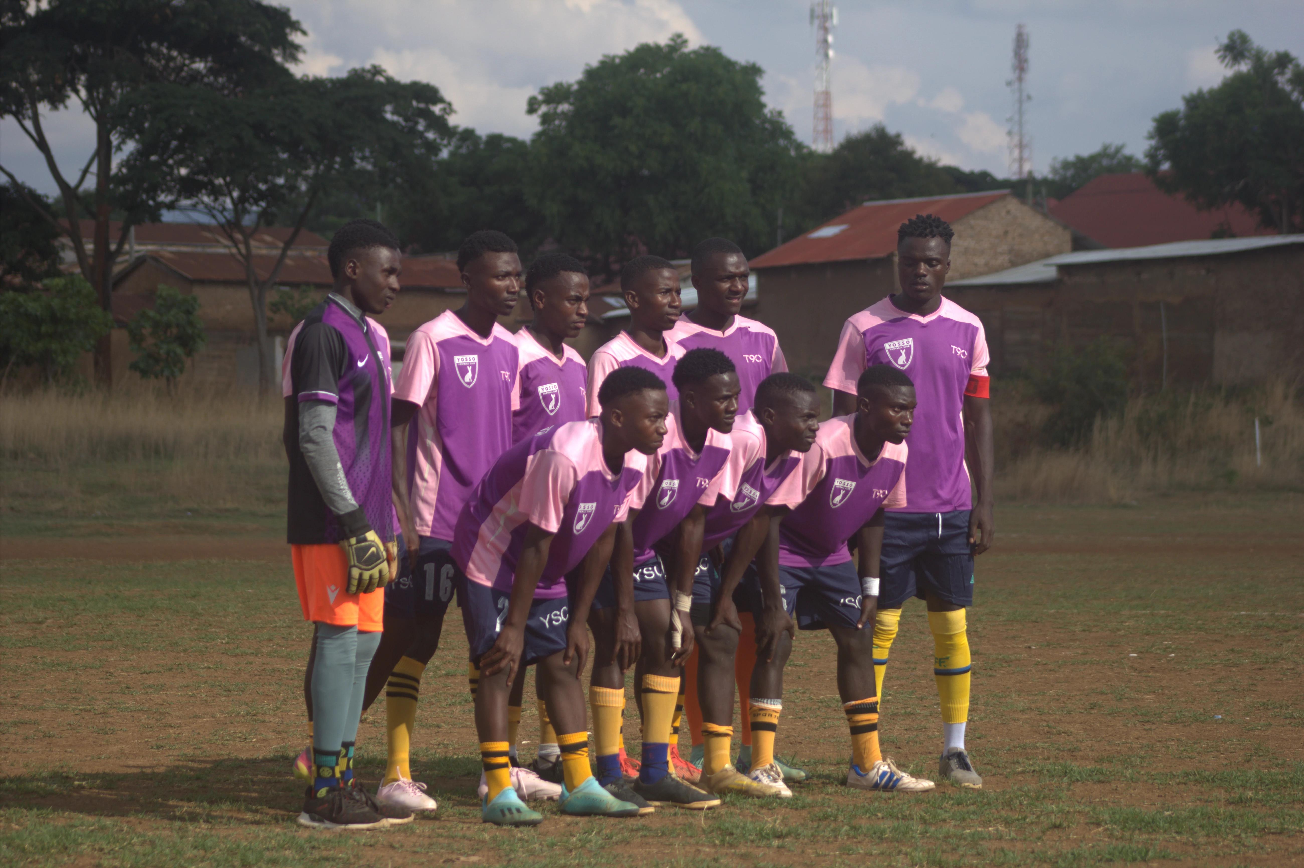 Yosso FC team lined up together ahead of a match