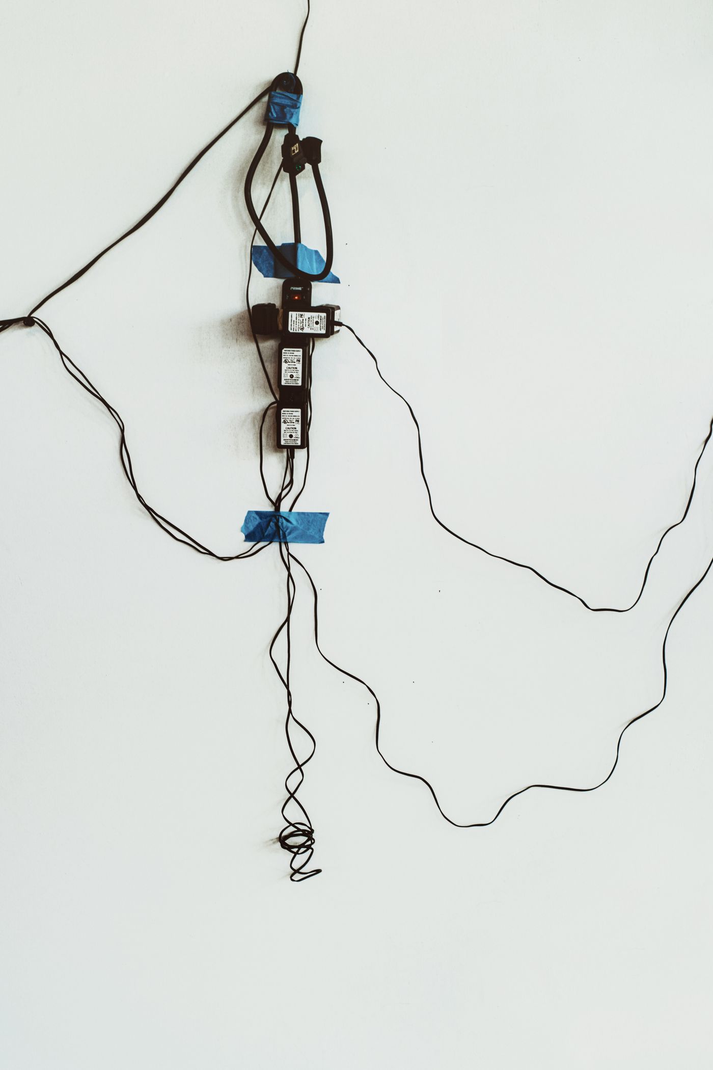 A cable system made up of outlets and cords for a sound system set up.
