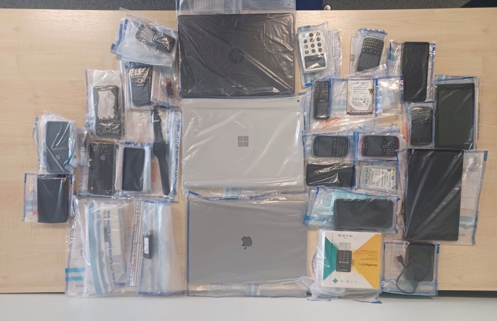 A collection of electronic devices authorities seized as part of the investigation into the LabHost phishing service. (Source: U.K. Metropolitan Police)