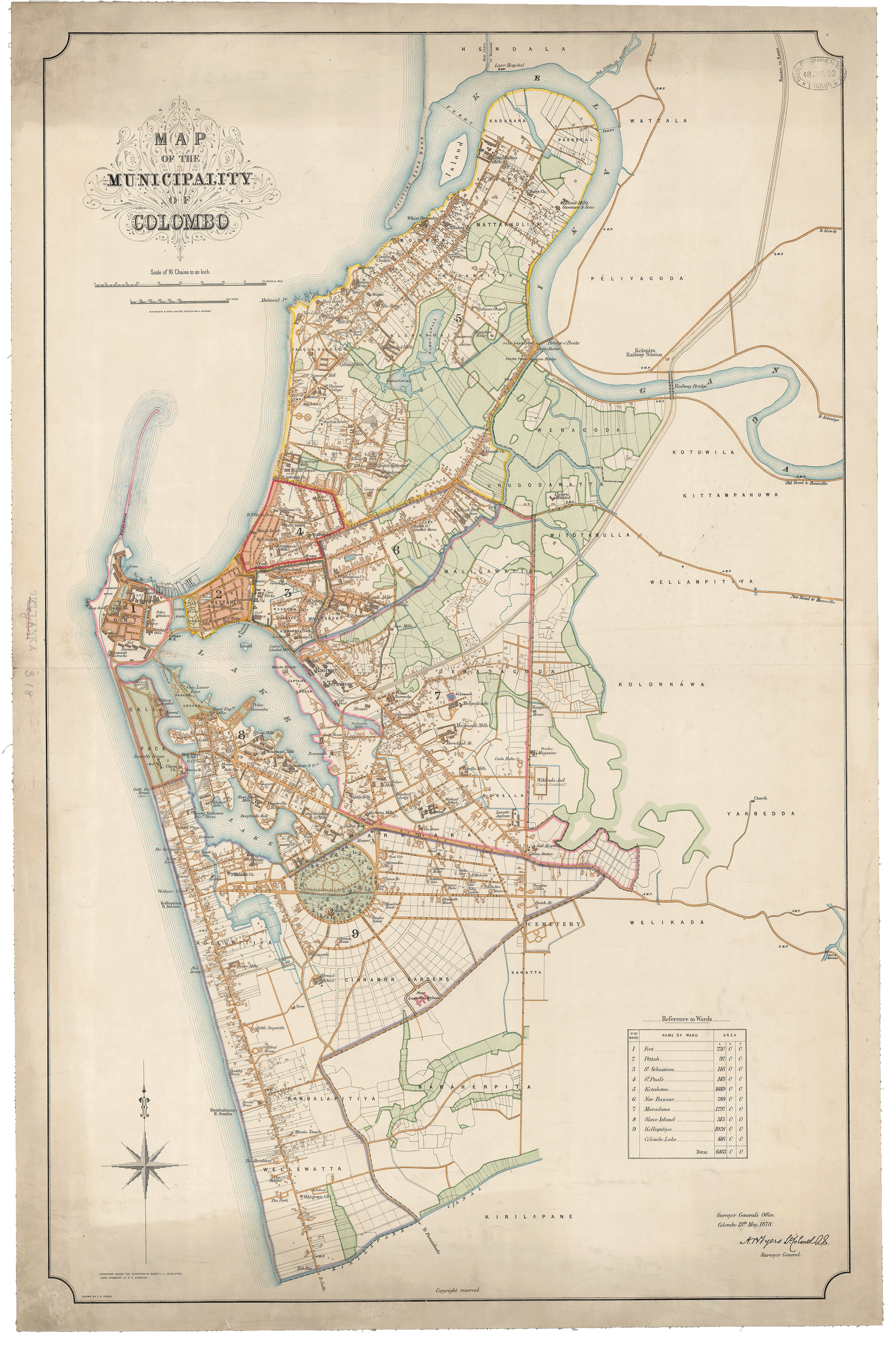 A late nineteenth century city plan of Colombo in Sri Lanka. The map is portrait and oriented north at the top. The city is situated on the southwestern coast of the island. Across the map you can see the road network highlighted in yellow, with administrative boundaries outlining parts of the city in different colours. Parks and green spaces are coloured green, and there is a decorative title cartouche. There is a key to the map in the lower right corner of the map.