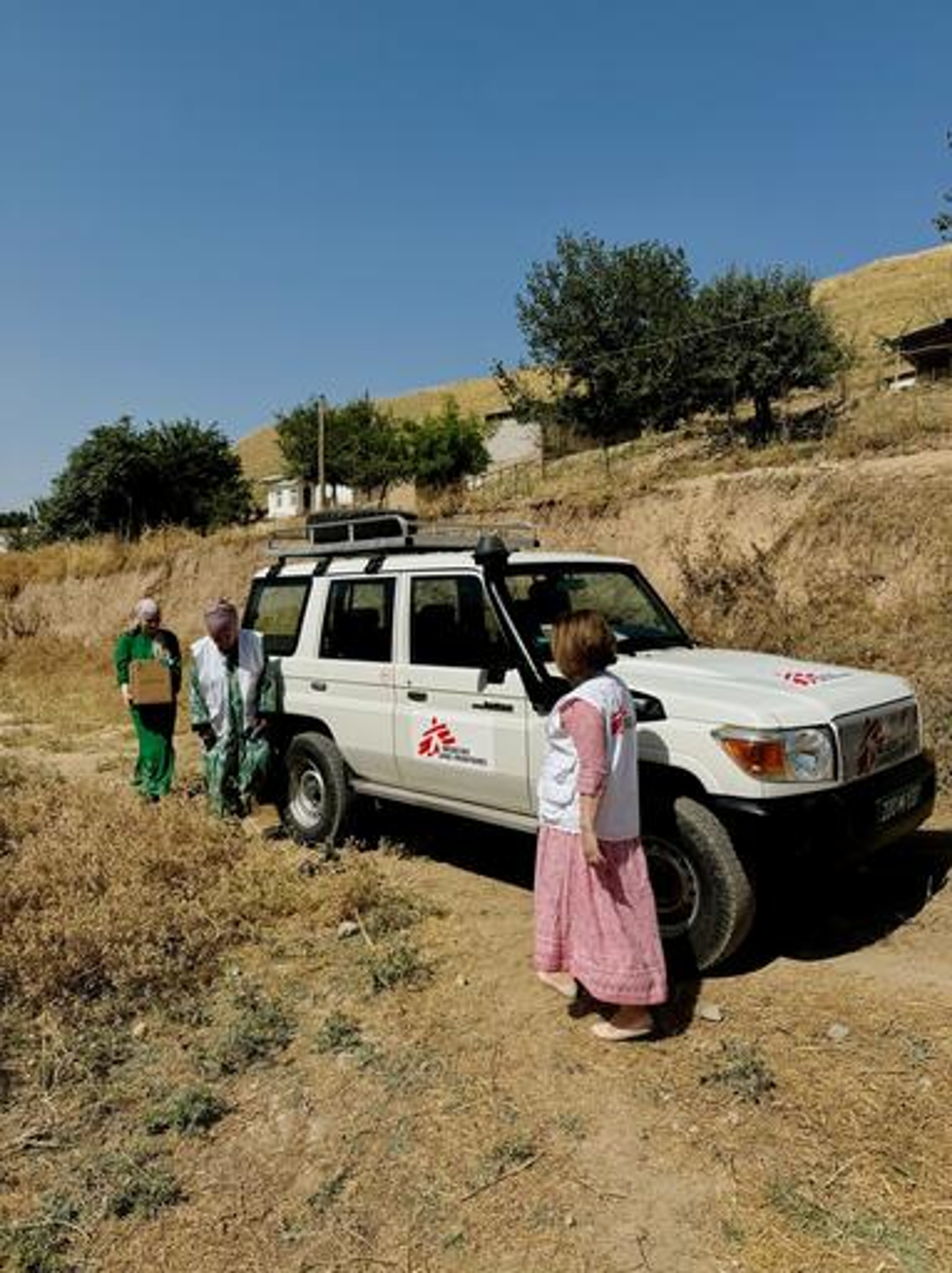 Medics from MSF and a local state hospital in Tajikistan visit a former TB patient in Kulob district.