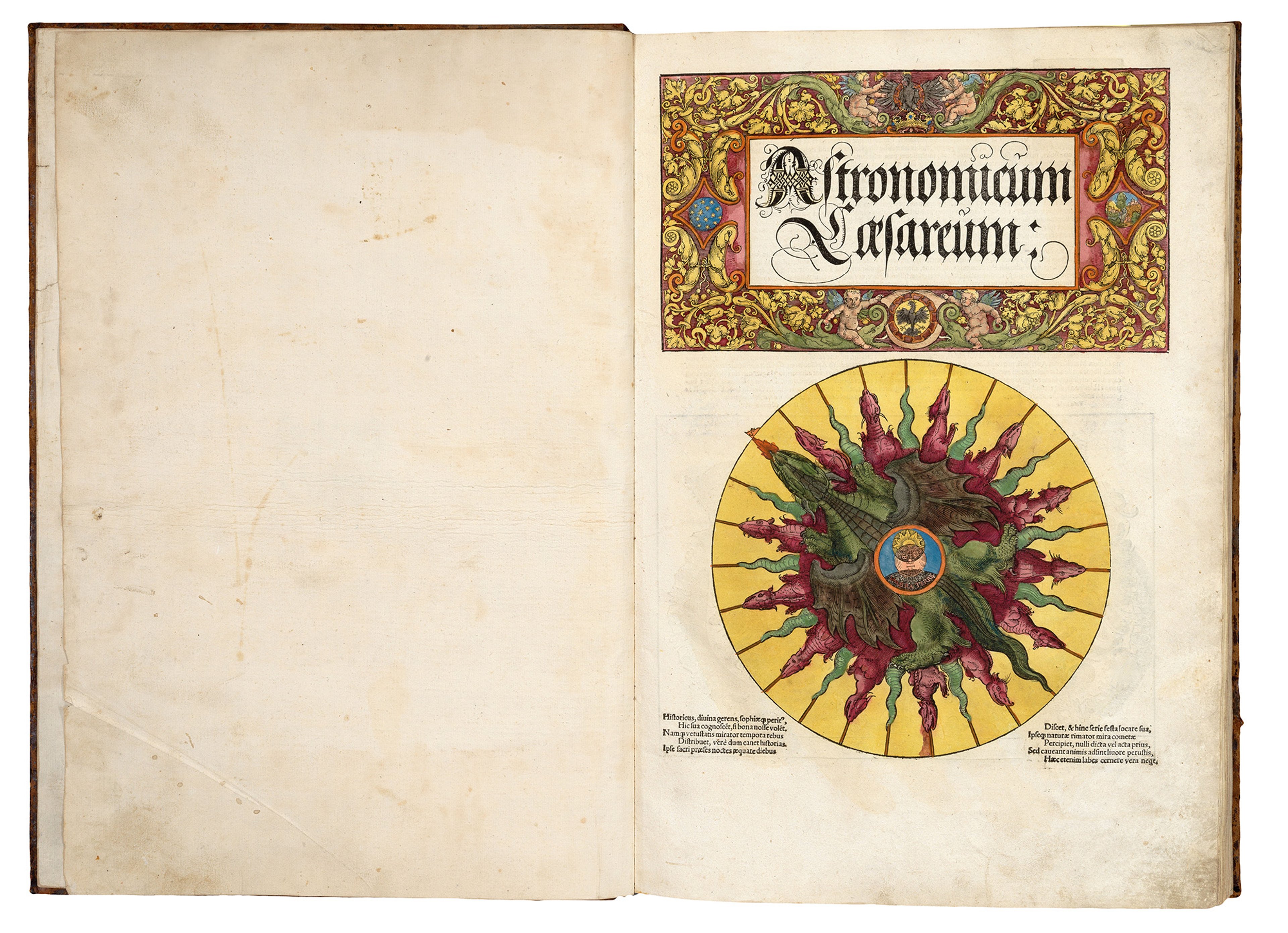 The colourful front pages for Peter Apian's scientific textbook 'Astronomicum Caesareum' (1540) which features gothic black lettering title and a floral border, and a volvelle dial detail with a dragon in rich yellow, red and green colouring.