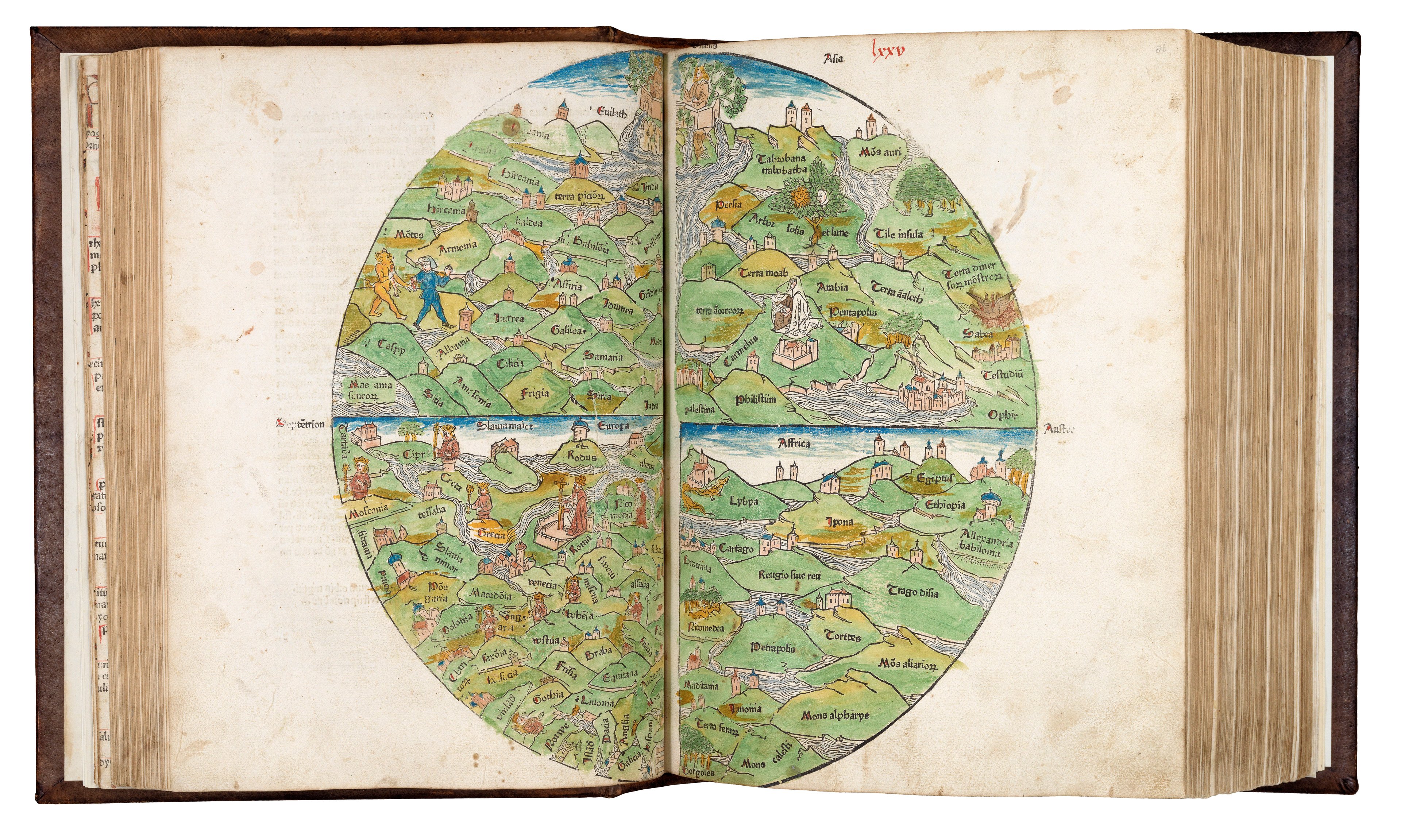 A thick, old book open at the page of a round world map. The map is from a woodblock print and is brightly coloured, mostly in green. It features many hills, streams, placenames, and figures from Biblical legends as well as Medieval myth. 