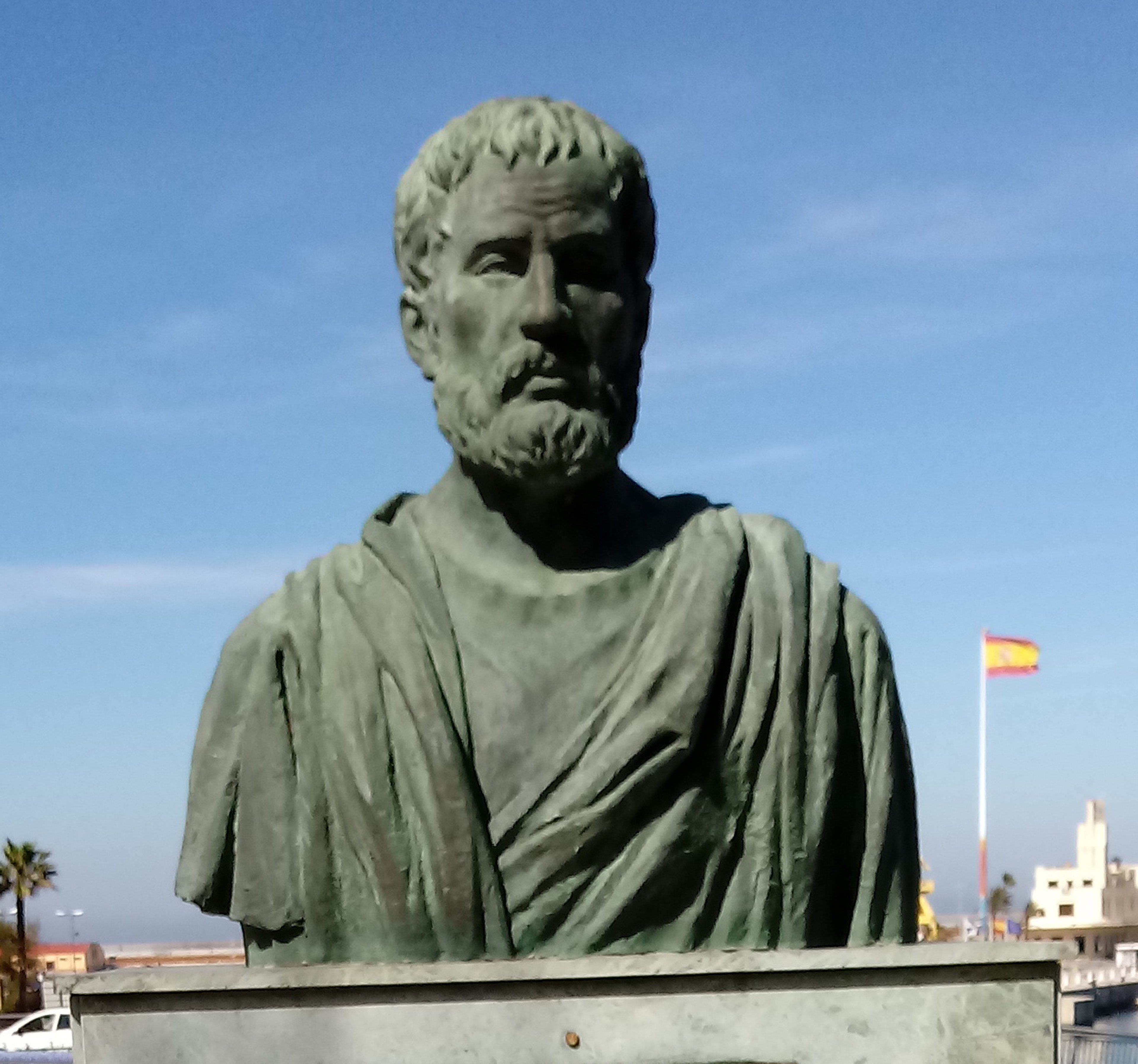 Bust of Roman geographer, Pomponius Mela, a man with short hair and a beard, wearing robes.
