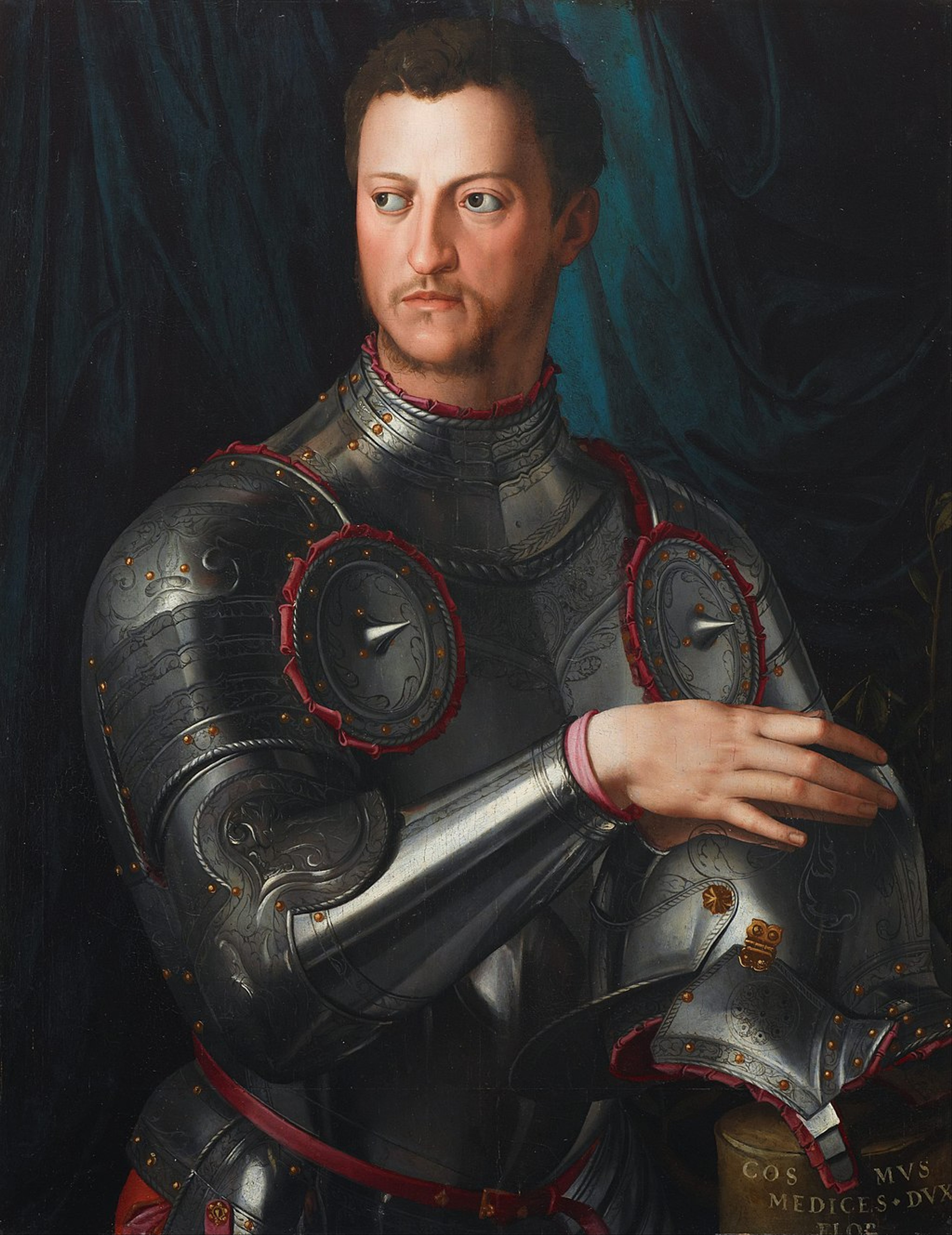 Colourful portrait of Cosimo I de' Medici, Grand Duke of Tuscany, a man with short brown hair, wearing a suit of armour and resting his right hand on a helmet.