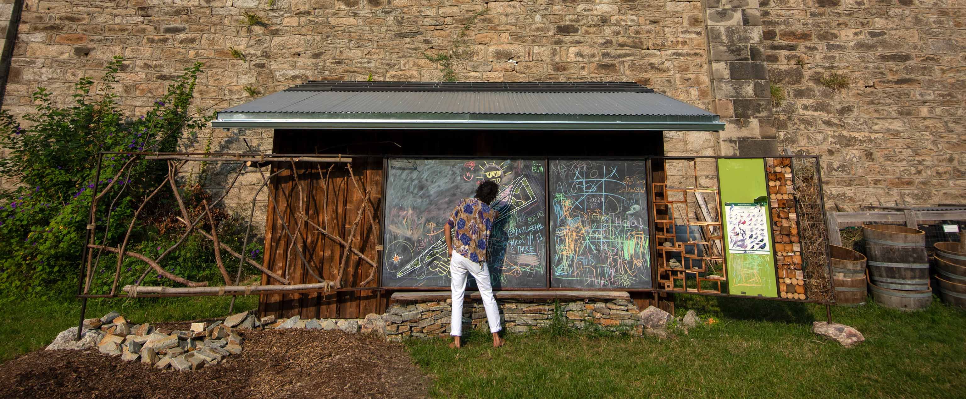 Jason at outside chalkboard