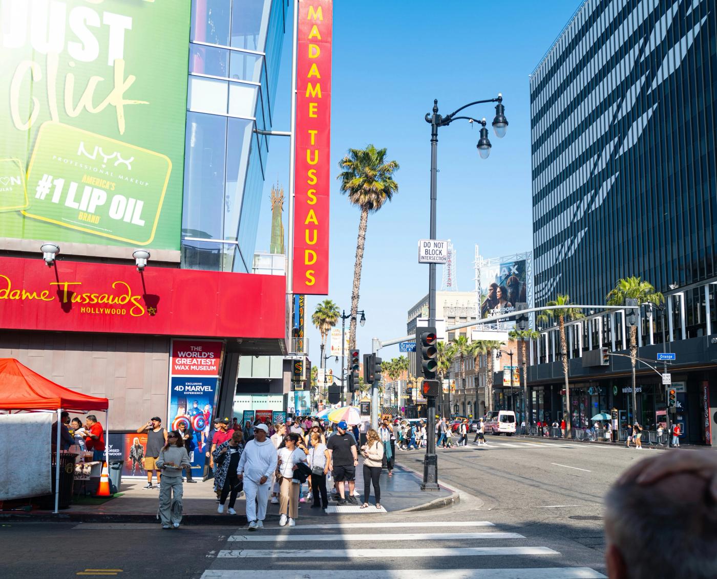 Pedestrians crossing a wide boulevard in Hollywood