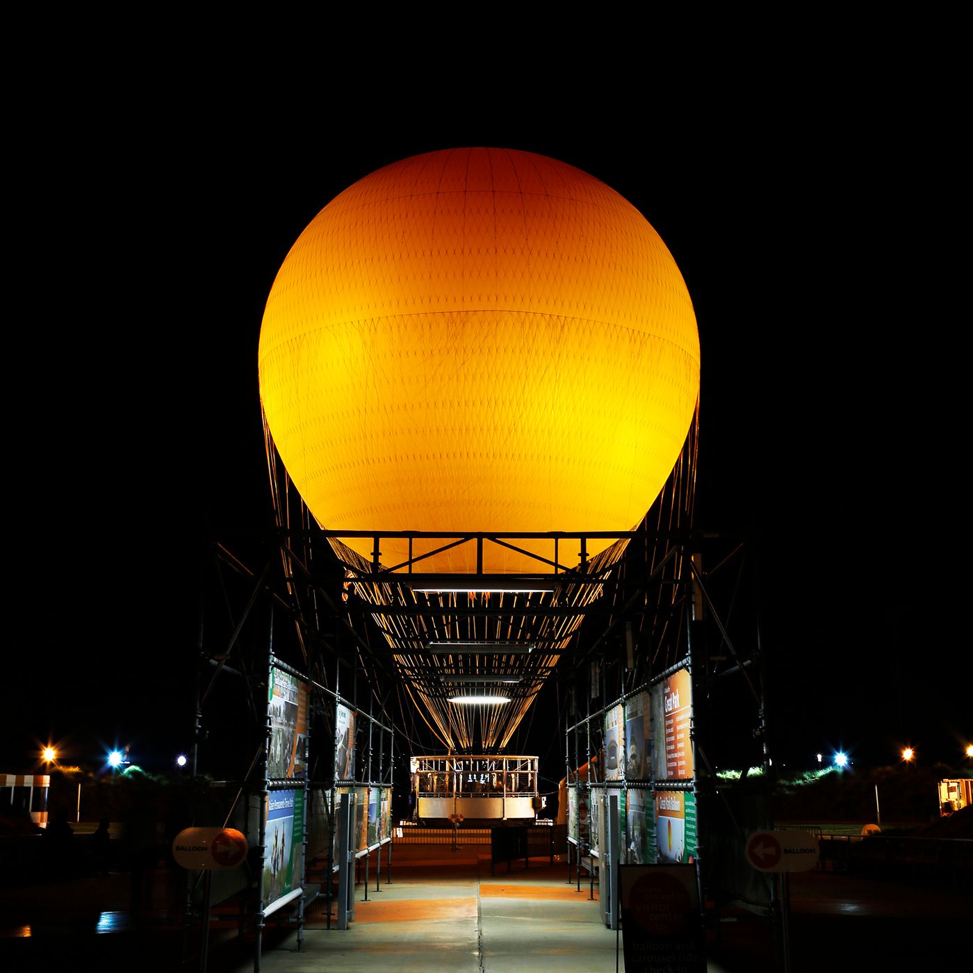 The orange Great Park balloon glowing against a night sky