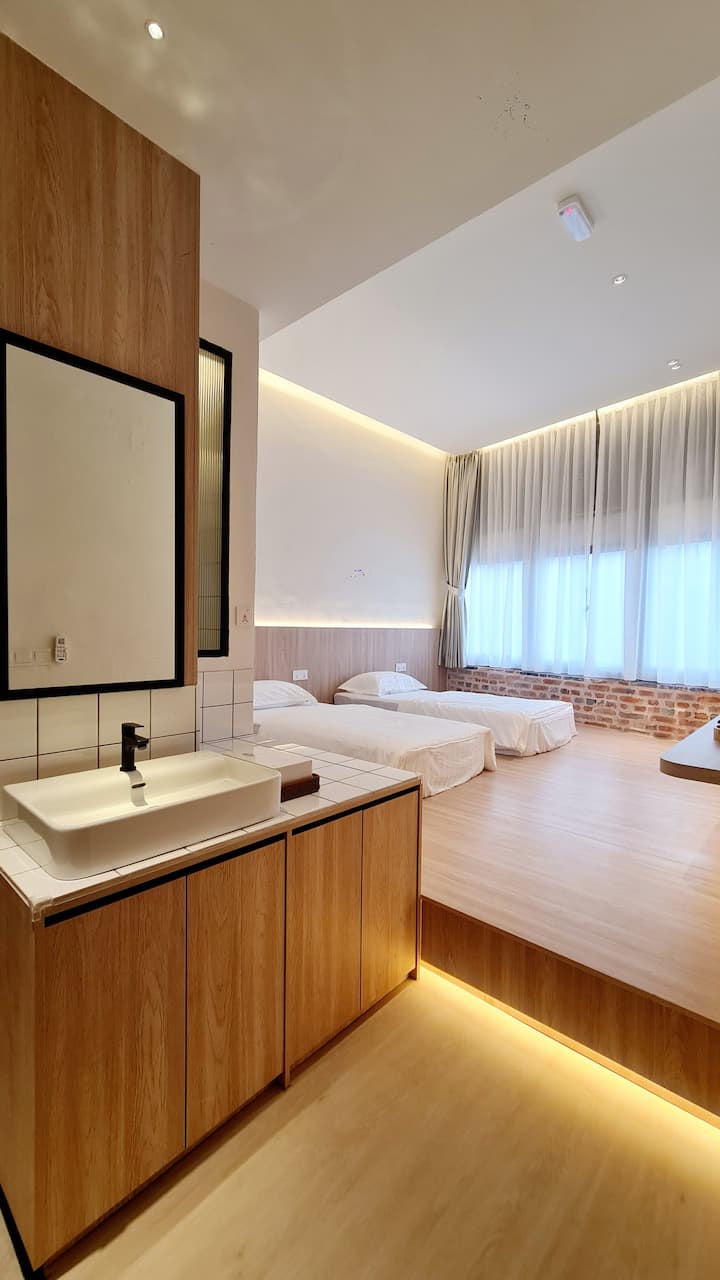 Kazuki twin beds from distance with vanity and heritage windows