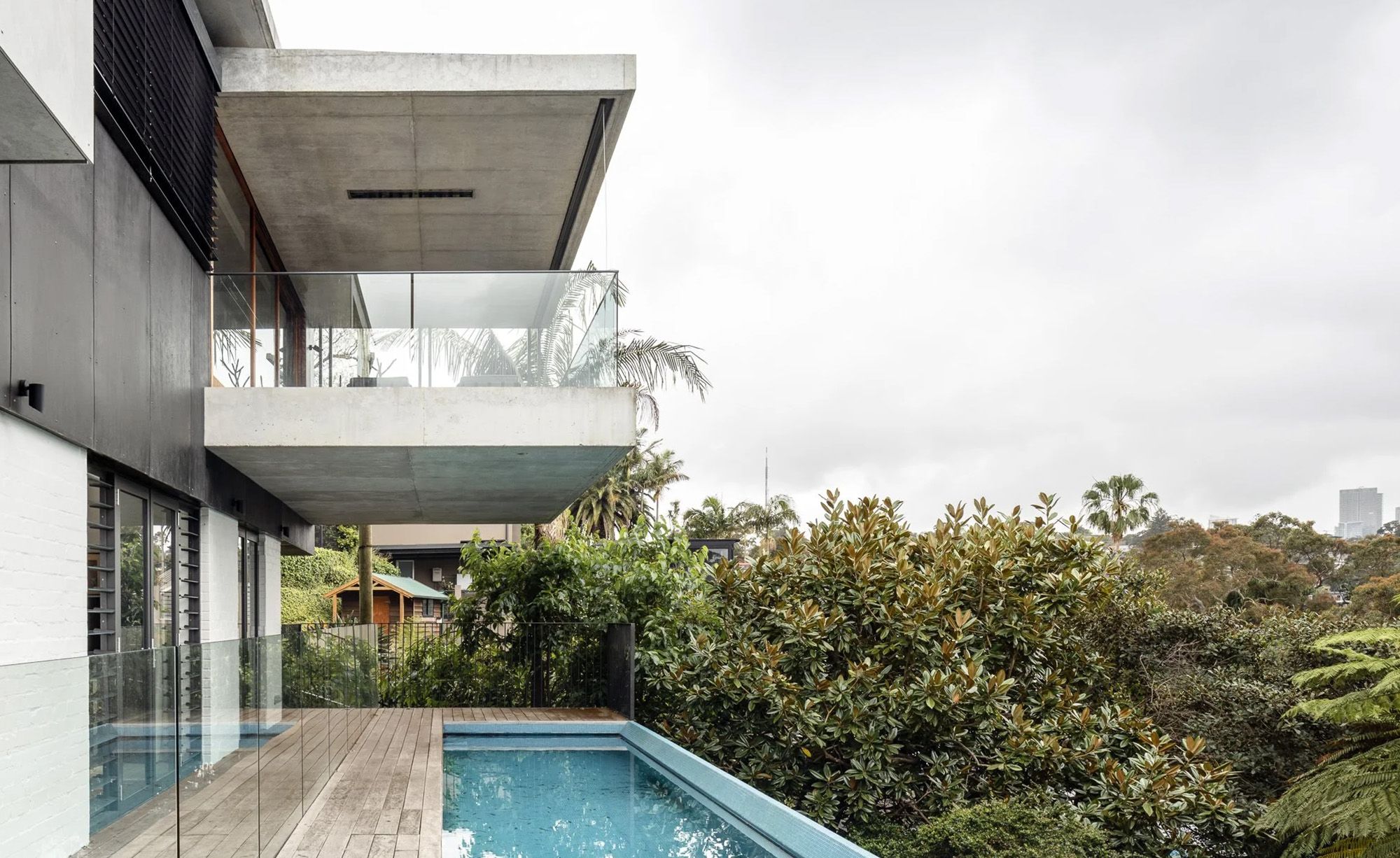 Bay House concrete balconies above the pool and garden