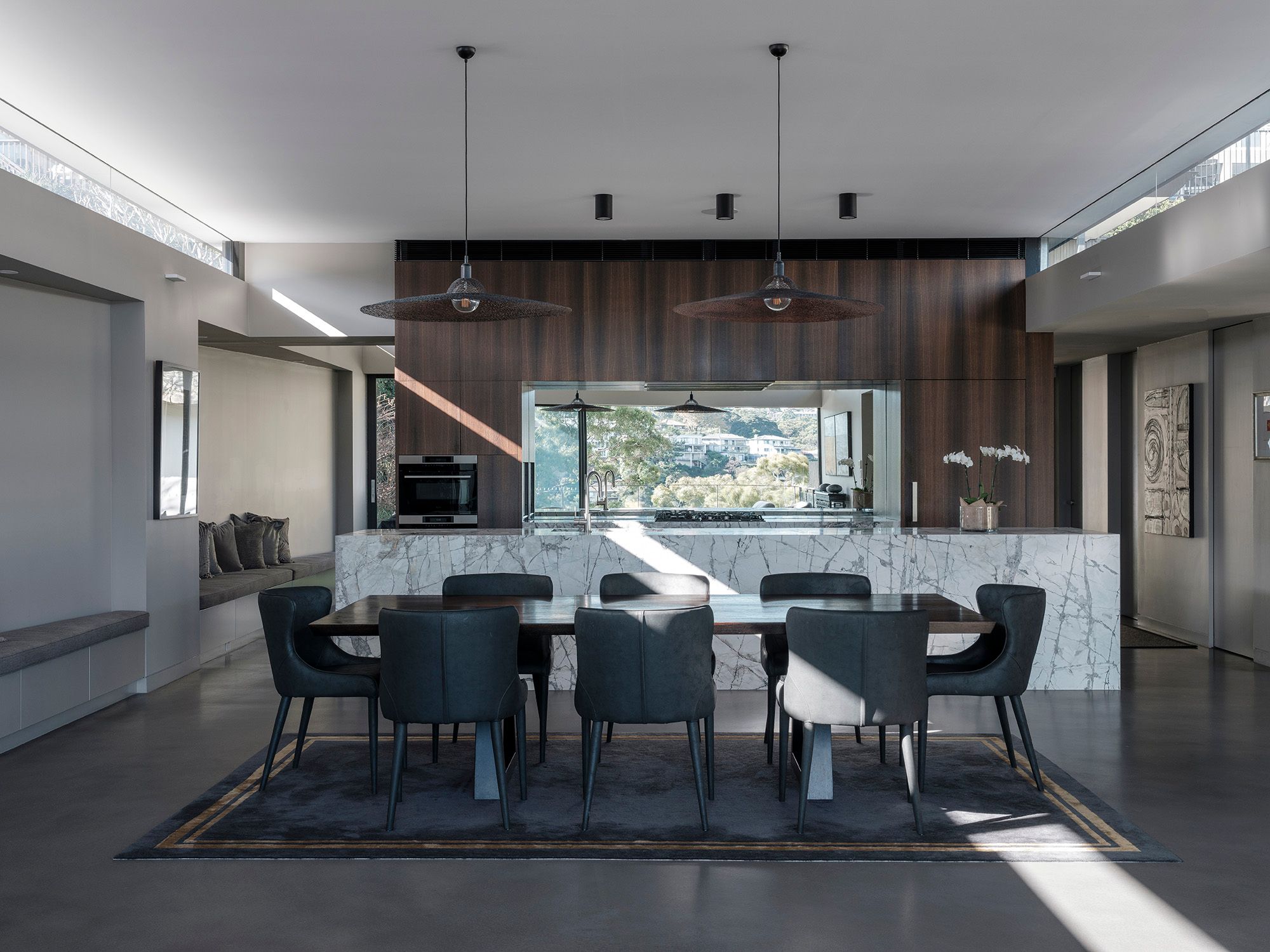 Dining room at Shellbank House with a marble island and timber joinery