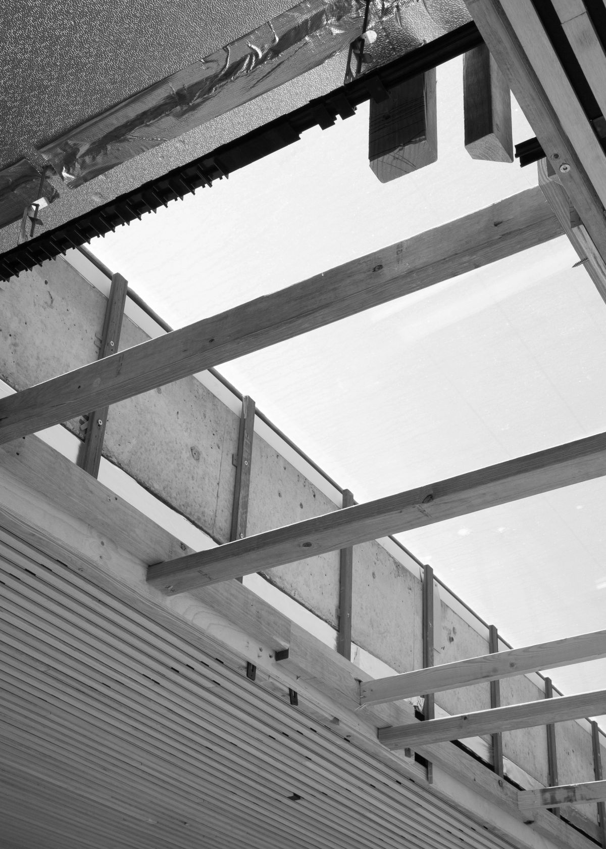Timber roof framing and a skylight opening during construction at Esplanade