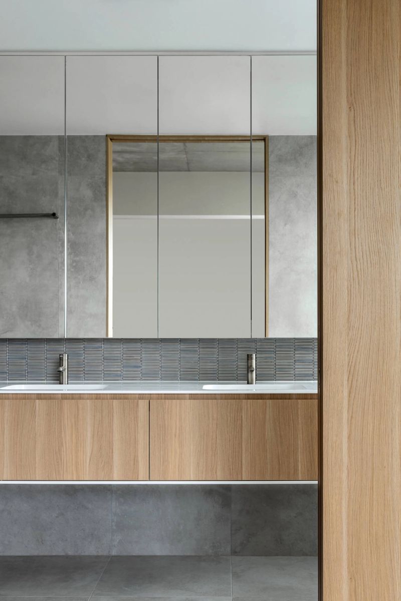 Bathroom vanity with timber drawers and a grey tiled splashback