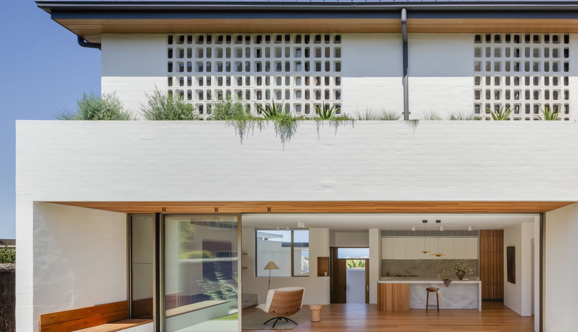Casa Risata rear elevation with a breeze block screen above the living room