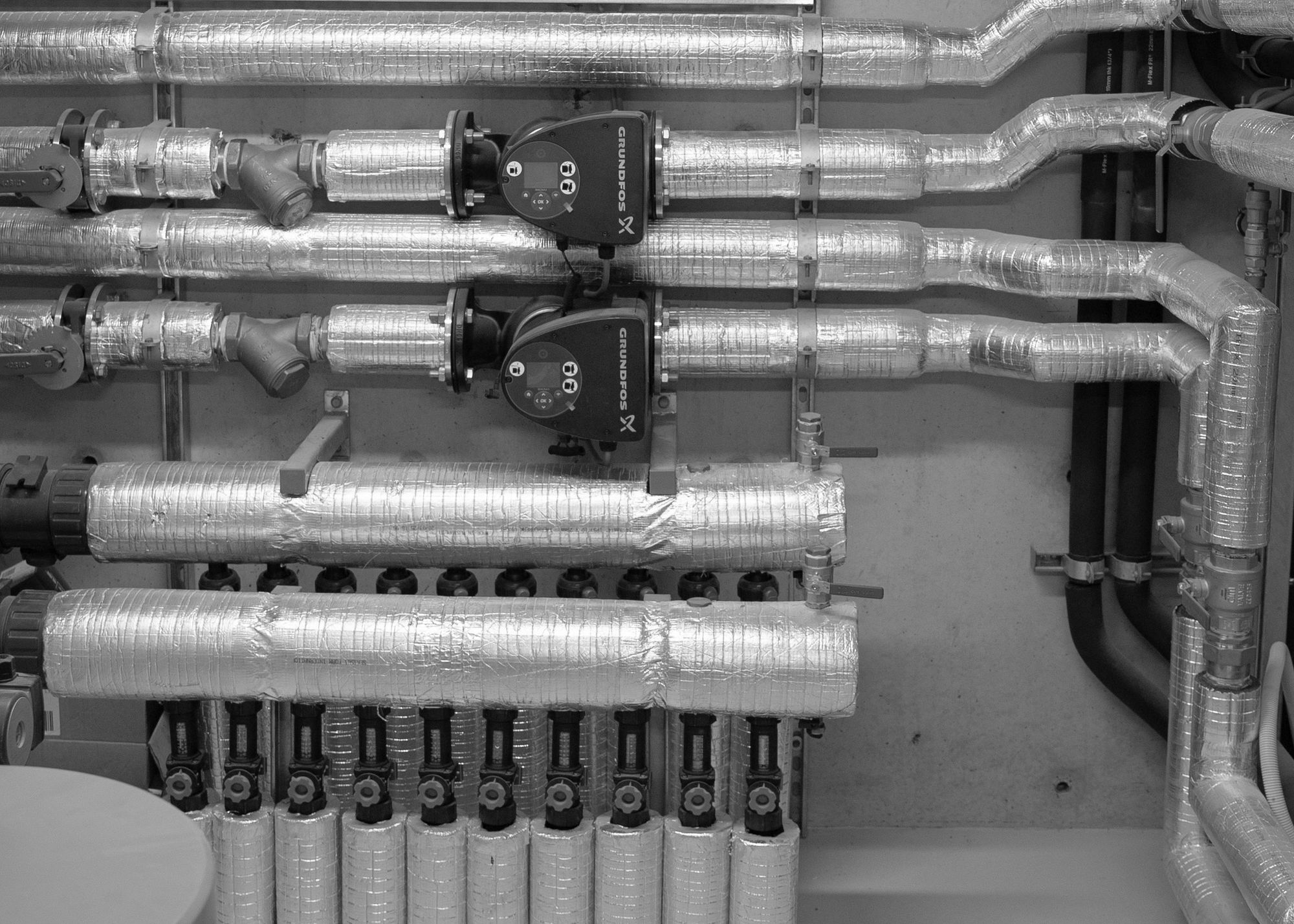 Insulated pipework and pumps in the plant room at Esplanade