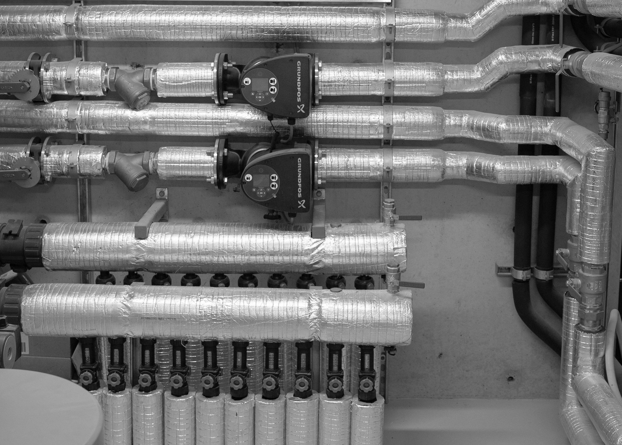Insulated pipework and pumps in the plant room at Esplanade