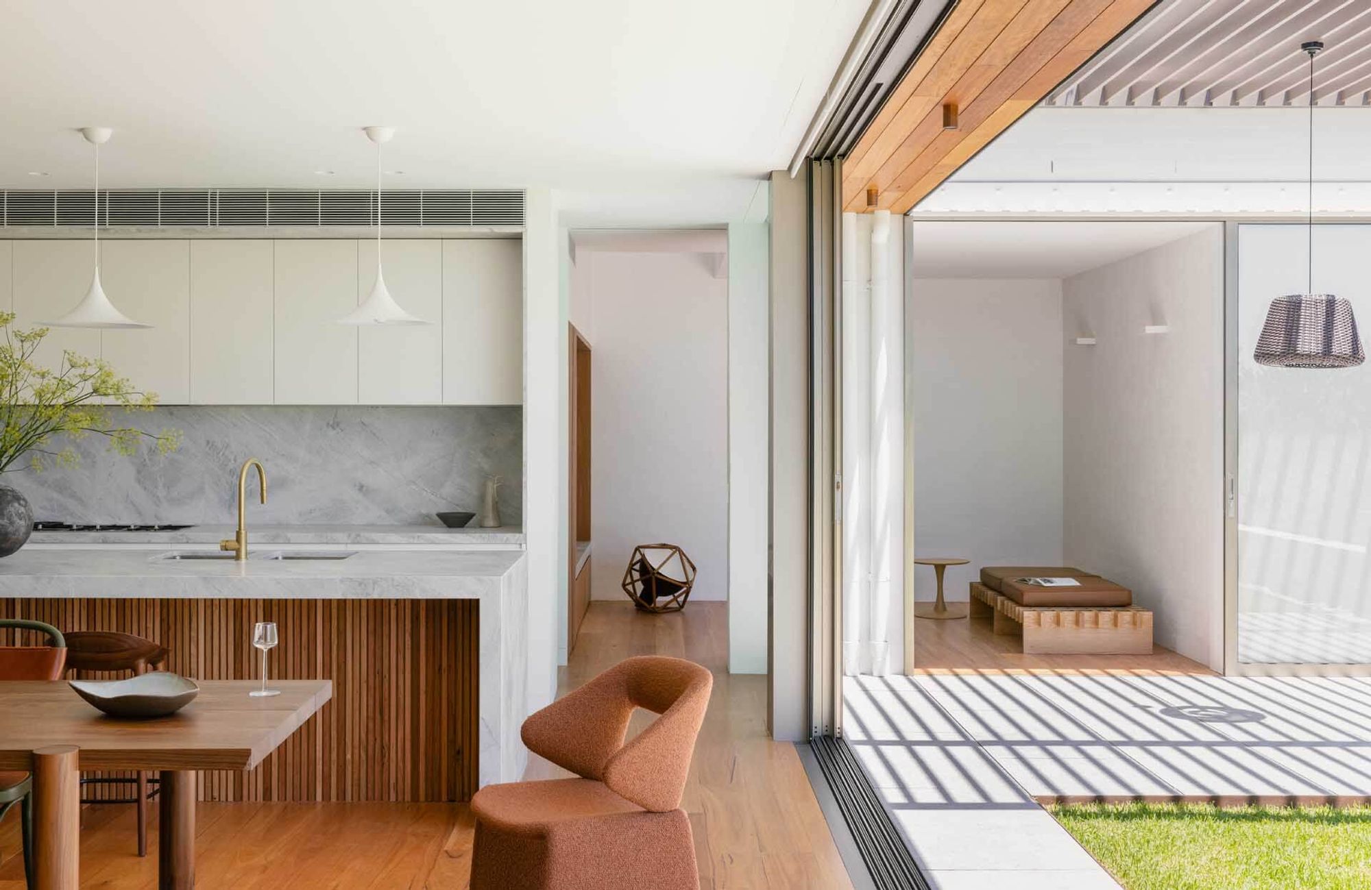 Kitchen and living room opening to the covered terrace at Casa Risata