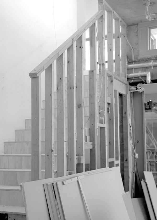Timber stud framing around a staircase during construction at Elizabeth Bay