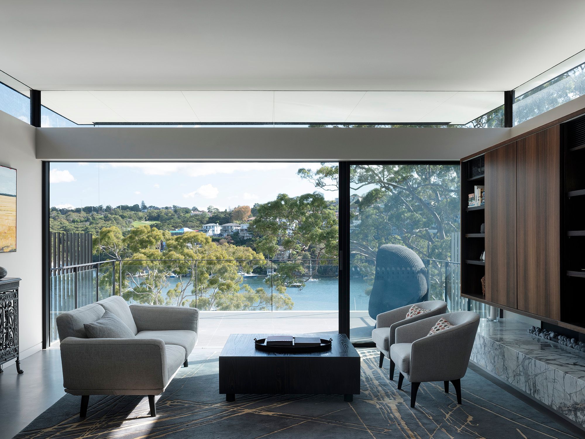 Living room at Shellbank House opening to a terrace over Middle Harbour
