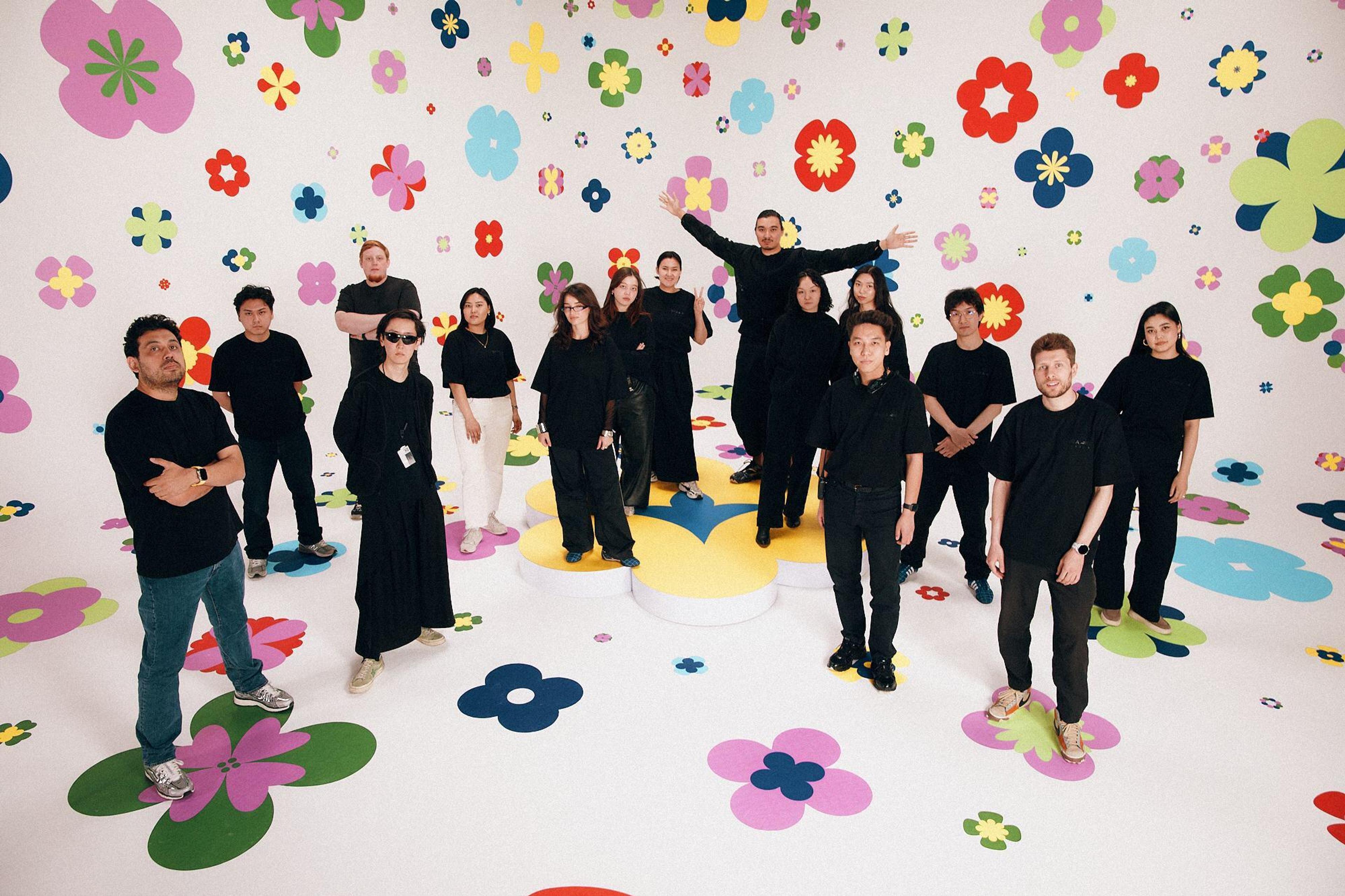 The QARA Studios team in a multicolored floral set