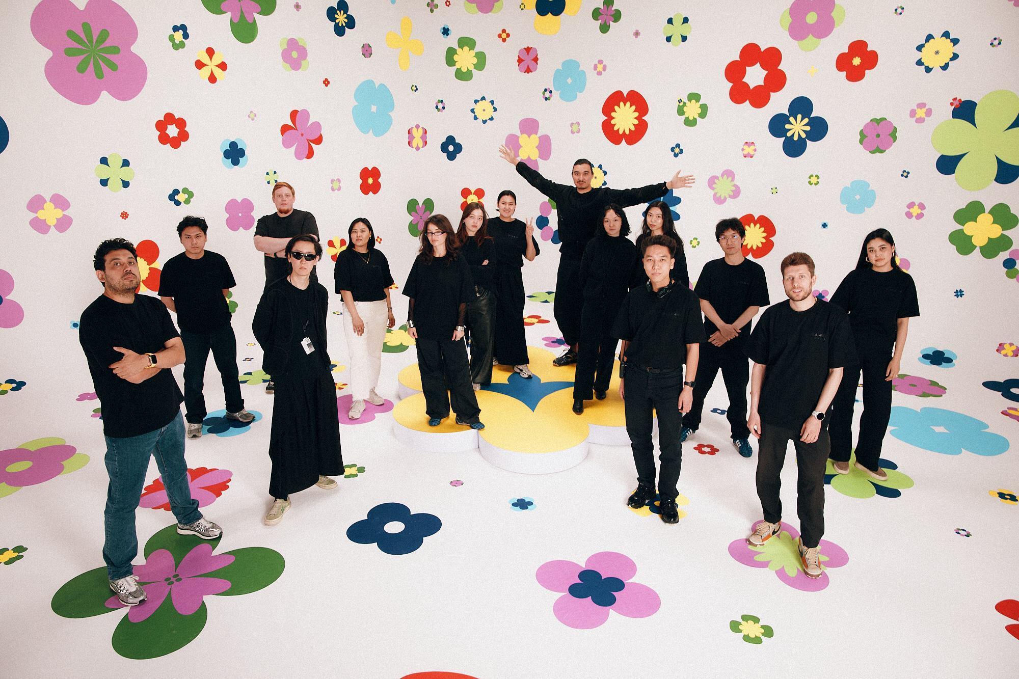 The QARA Studios team in a multicolored floral set