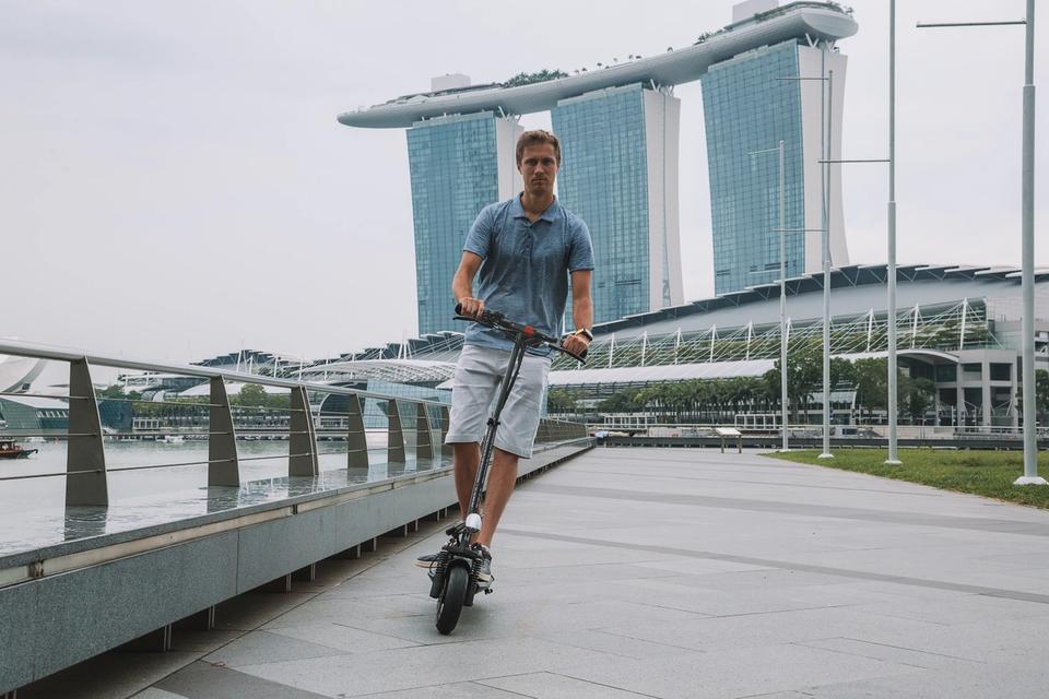 Man riding a long-range electric scooter in Singapore