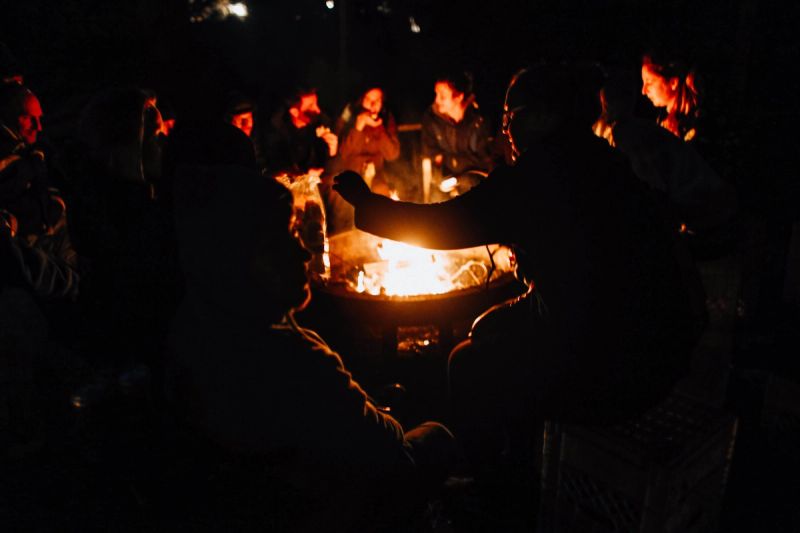 People gathered around a fire pit