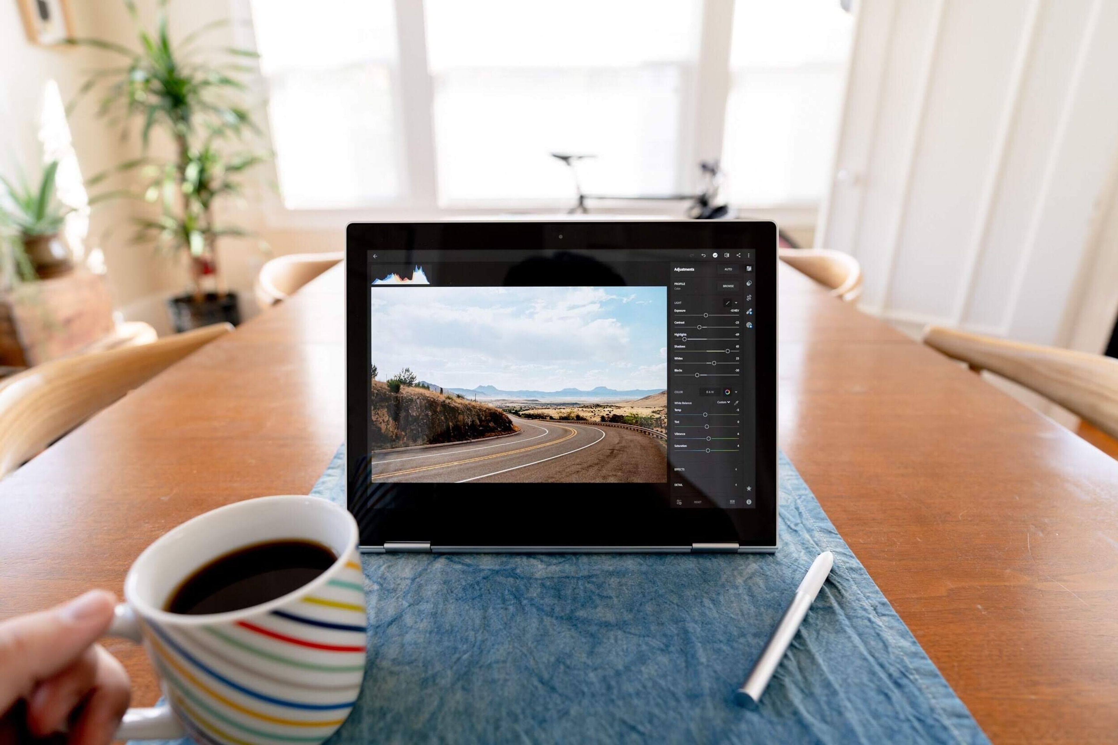 Chromebook Pixel on a table beside a cup of coffee