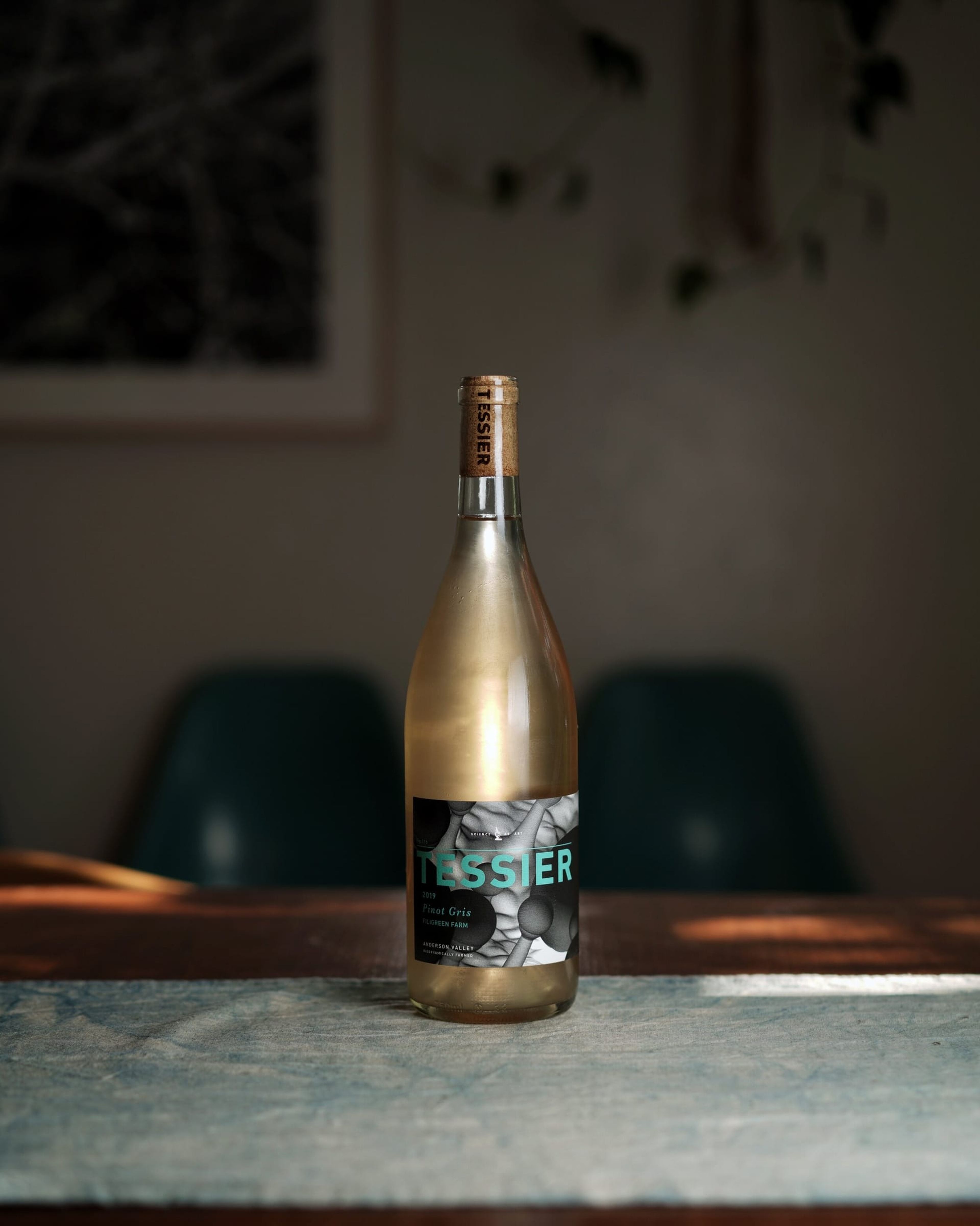 Bottle of Tessier white wine on a stone table
