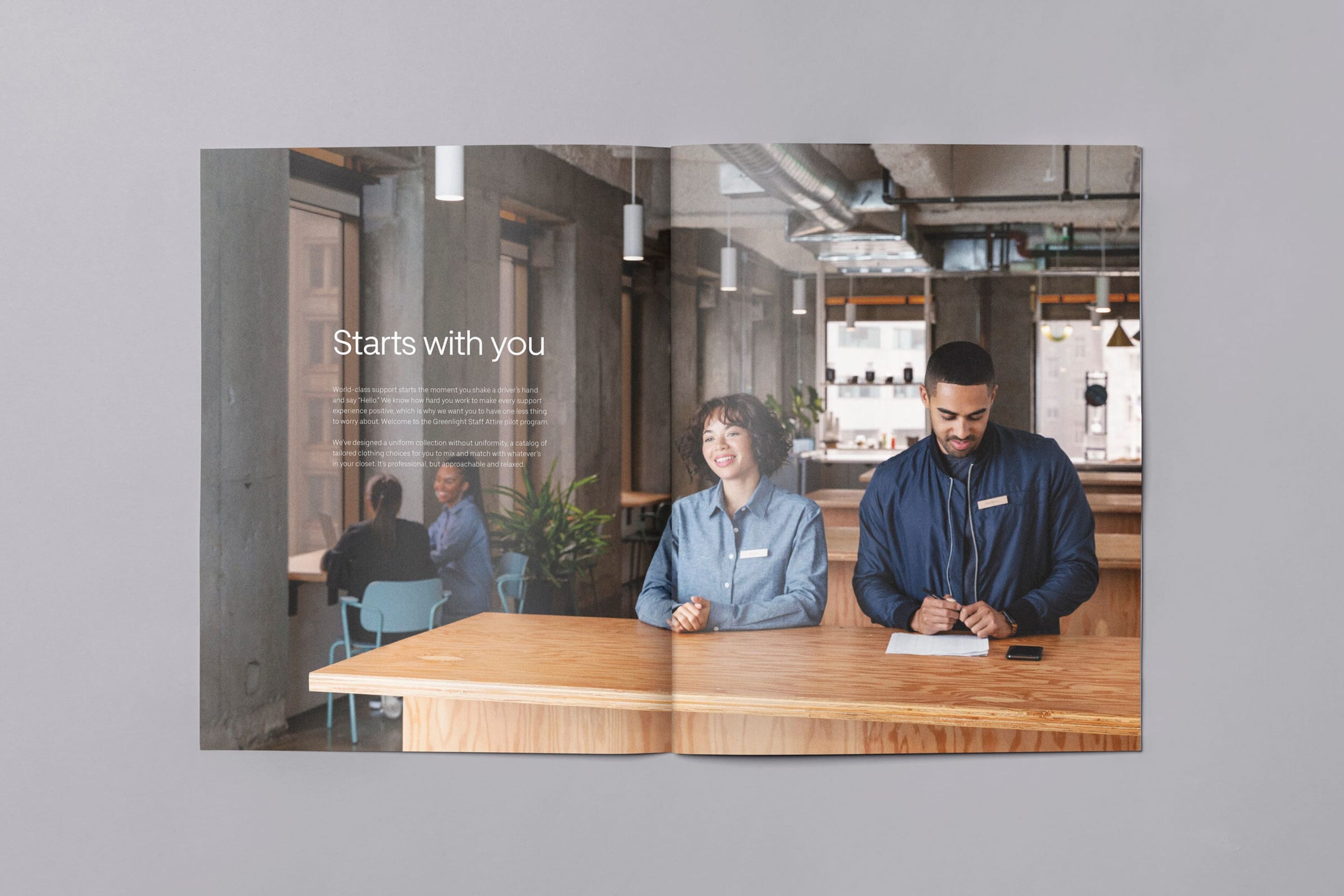 Uber Greenlight Hub lookbook spread: two staff at a front desk, “Starts with you”