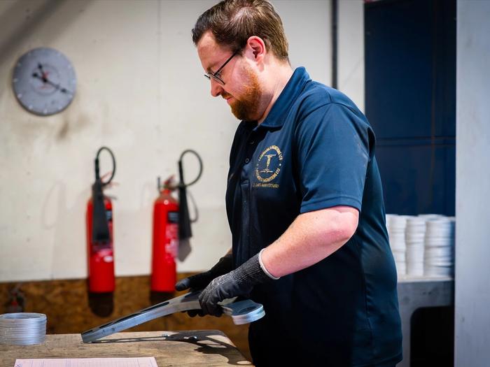 Engineer working on a fabricated part