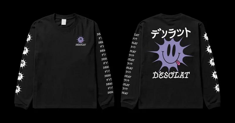 The shirt from front and back. It features a violet sun-like smiley with the name of the band below. The logo is printed small on the front and on the back. On the back, the name of the band is also written in Japanese letters. The left sleeve features a column of variations of the sun smiley, smiling and frowning, in white print. The right sleeve features a column of the name of the Band, alternating between arabic and japanese letters.