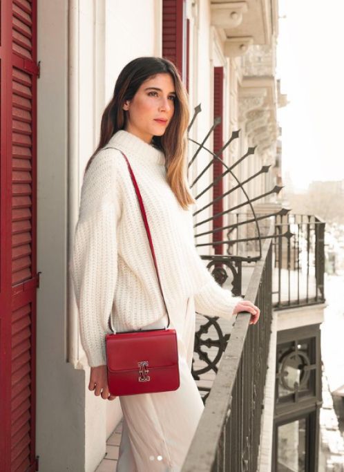 Belen Hostalet with a red, Cartier purse