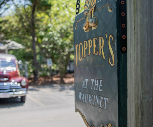 Dine at Topper's, a casual waterfront restaurant at The Wauwinet, serving fresh local seafood and island-inspired cuisine.
