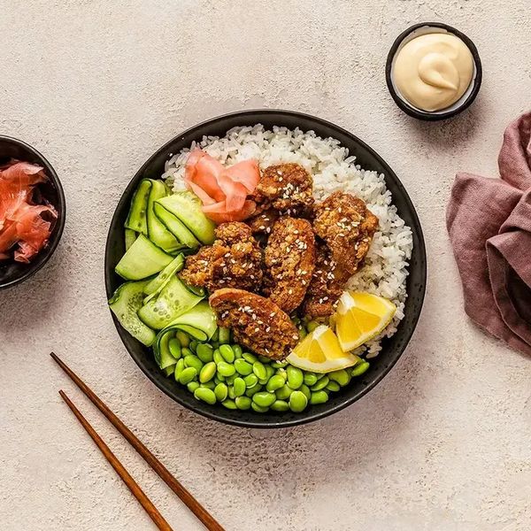 Karaage chicken bowl with sushi rice, carrot and furikake