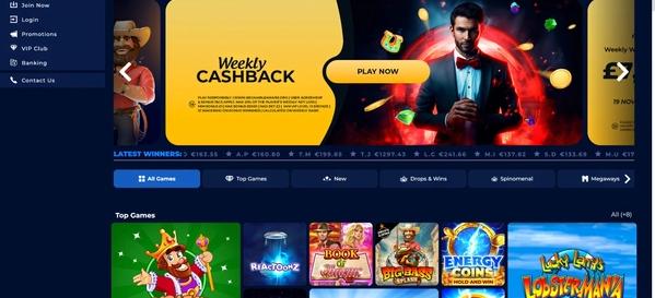 WinOmania casino desktop homepage with Weekly Cashback promo, top games like Scratch King, and Latest Winners section.