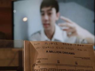 A student taking online classes with notes written on their music sheets.