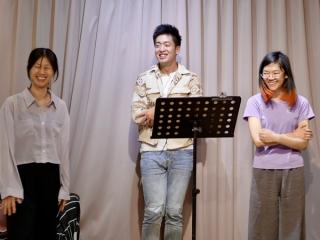 3 students sand a up-tempo musical number.