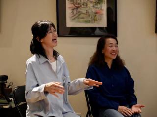 Two students happily sharing their thoughts.