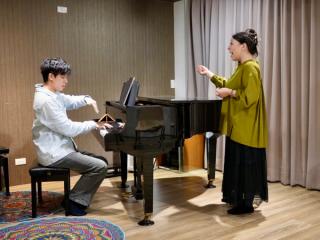 Leon teaching vocal technique to a student.