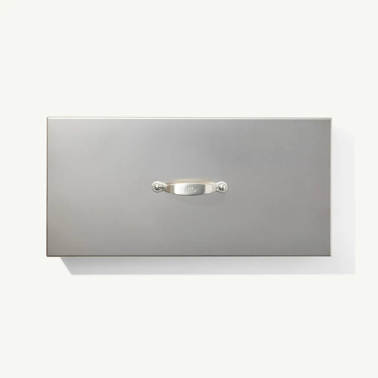 A silver drawer front is shown against a white background with a simple metal handle attached to its center.
