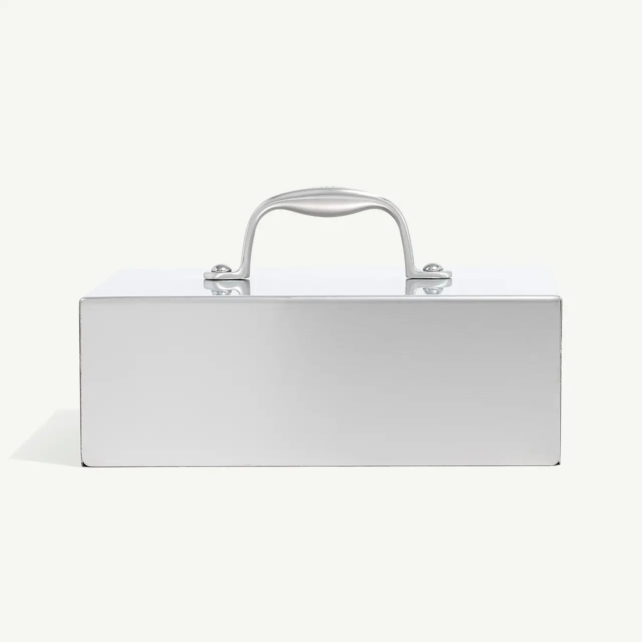 A silver metal briefcase with a sturdy handle and simple locking mechanism, placed against a light background.