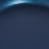 A close-up of a blue object with a smooth texture and subtle sparkle, resembling either a polished stone or a piece of colored glass.