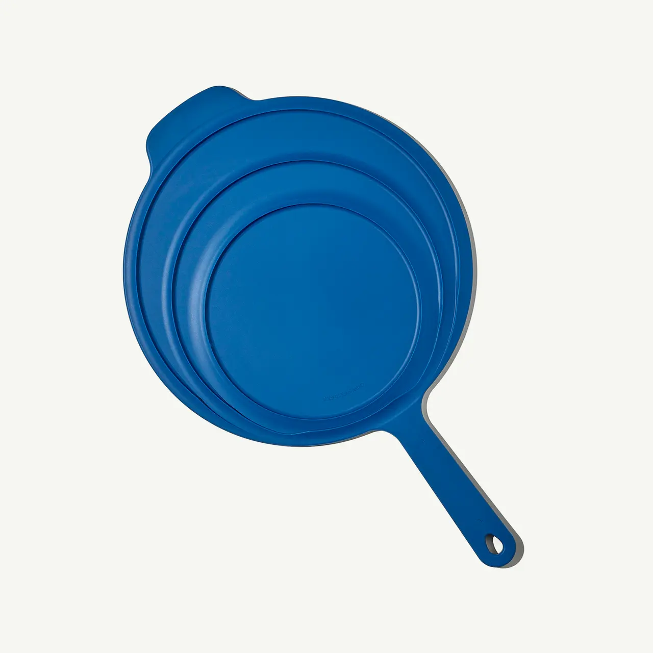 A blue silicone suction lid is displayed centered against a light background.