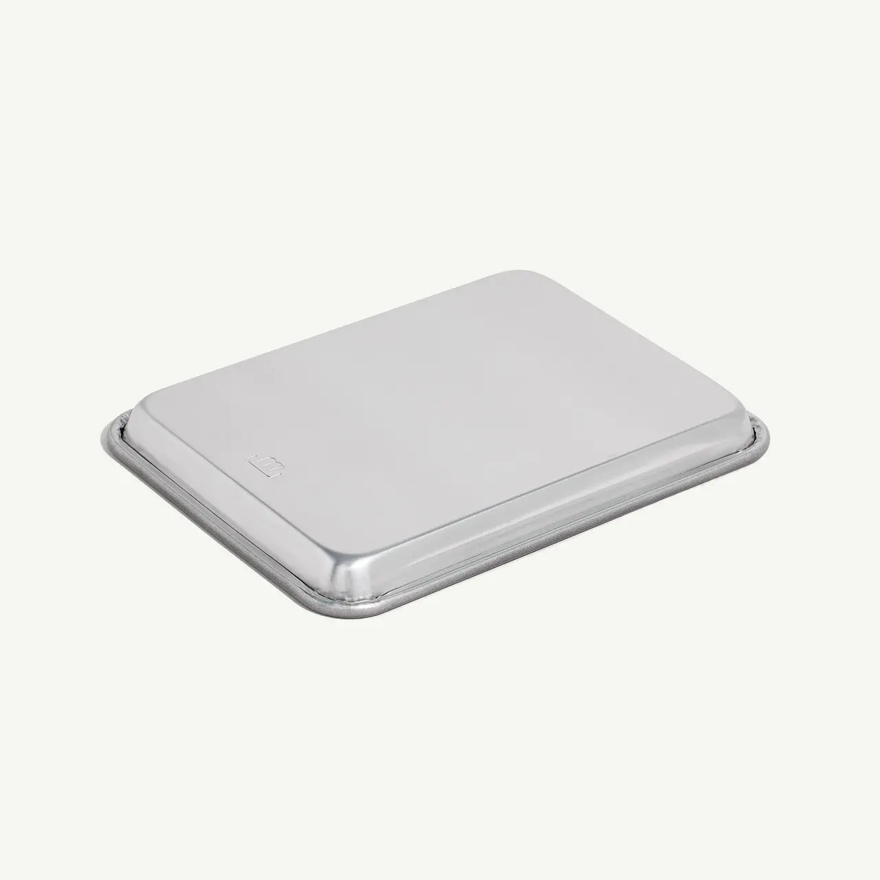 A silver external hard drive is shown against a white background.